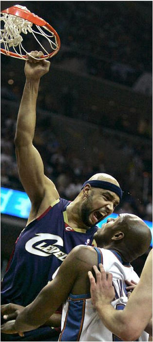 Third Place, Sports Picture Story - Ed Suba, Jr. / Akron Beacon JournalThe intensity of play from both teams was evident from the start of the series as Cleveland forward Drew Gooden punctuates a dunk by screaming at Washington defender Antwon Jamison during the Cavaliers 97-96 victory over the Wizards in Game 2 of the first-round Eastern Conference playoffs at the Verizon Center on April 28, 2006, in Washington D.C. 