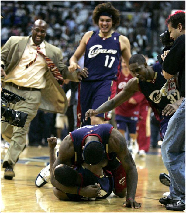 Third Place, Sports Picture Story - Ed Suba, Jr. / Akron Beacon JournalCleveland Cavalier LeBron James tackles and congratulates teammate Damon Jones after his last second shot led the team to a 114-113 overtime win over the Washington Wizards in Game 6 of the first-round Eastern Conference playoffs at the Verizon Center, May 5, 2006, in Washington D.C. It put the Cavaliers in the conference semi-finals for the first time since 1975.