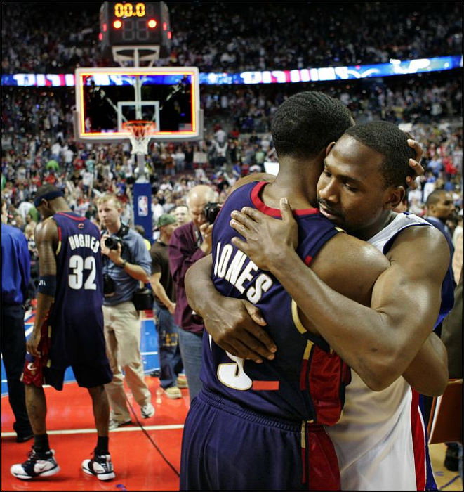 Third Place, Sports Picture Story - Ed Suba, Jr. / Akron Beacon JournalTime and the playoff run come to an end as Cleveland guard Damon Jones is hugged by Detroit guard Lindsey Hunter after  the Cavaliers 79-61 loss to the Pistons in Game 7 of the semifinals of the Eastern Conference playoffs at Quicken Loans Arena on May 21, 2006, in Auburn Hills, Michigan. 
