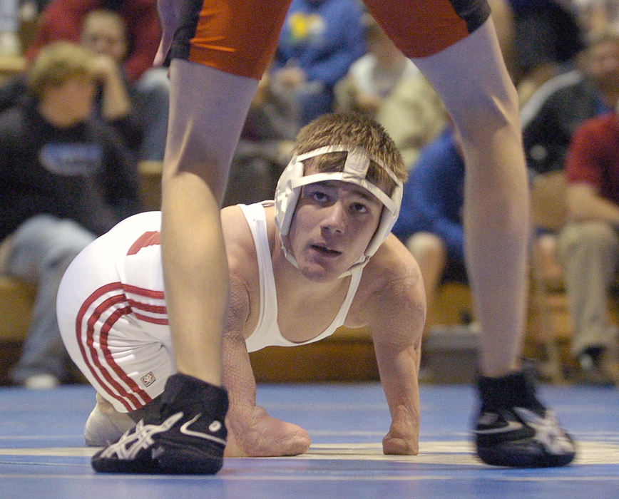 First Place, Sports Picture Story - Jeff Swinger / Cincinnati EnquirerDustin eyes his opponent Ethan Allen from Wilmington High School during their match at Amelia.