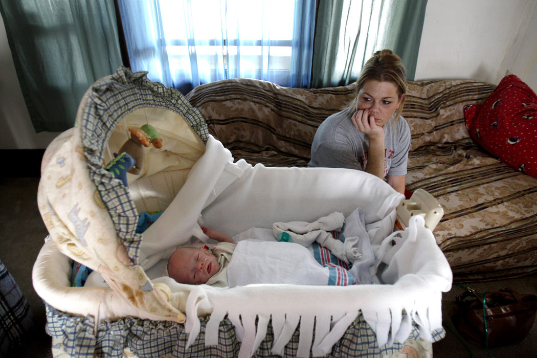 First Place, Feature Picture Story - Chris Russell / The Columbus DispatchAfter having spent all night at the hospital with Riley,  learning more about what he would need to keep him healthy at home and getting little sleep, Beth stares and worries about the future. 