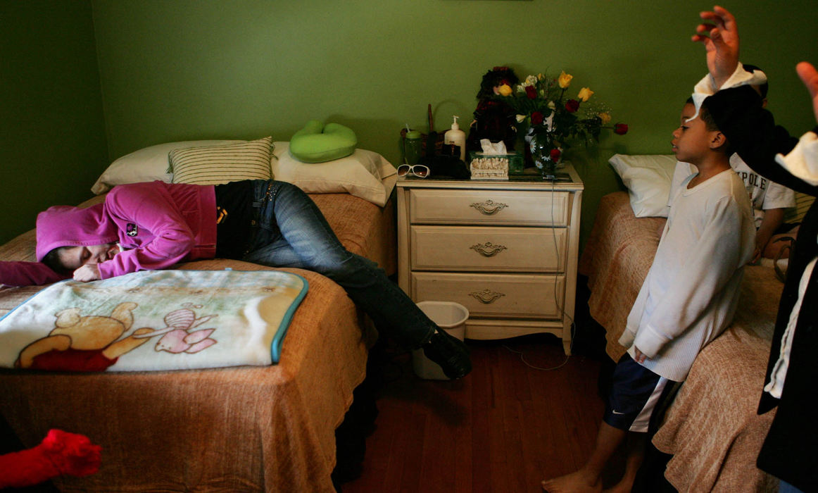 Second Place, Feature Picture Story - Gus Chan / The Plain Dealer Johanna flops onto her new bed, relieved when she gets to her Aunt Hilda Hernandez's house, where she decided to stay. She doesn't want to return to the house where she was shot.  