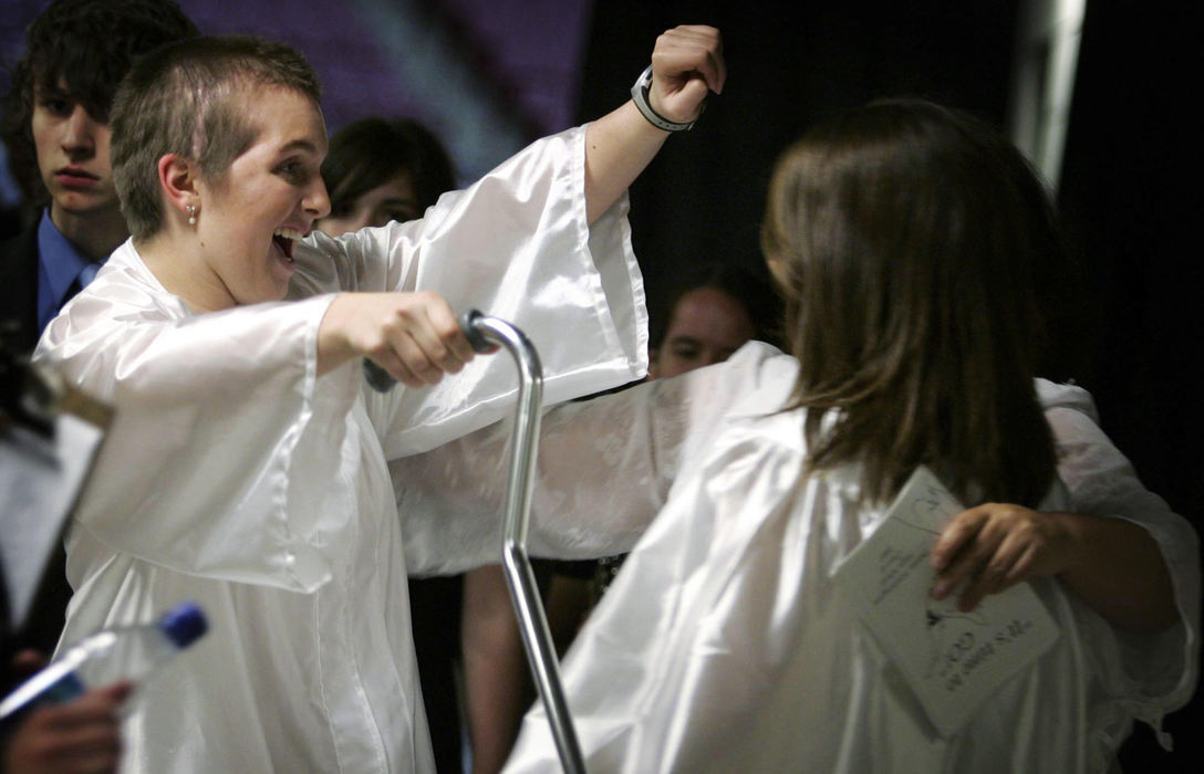 Third Place, Feature Picture Story - Shari Lewis / The Columbus DispatchRachel Barezinsky celebrates on graduation day with classmates. As senior year approached, Rachel dreamed about getting her high-school diploma, going off to college and starting a new, exciting life. Rachel participated in commencement and had more than enough credits to be done with high school, but she agreed with her family that she would not graduate, to remain eligible for special-education classes.