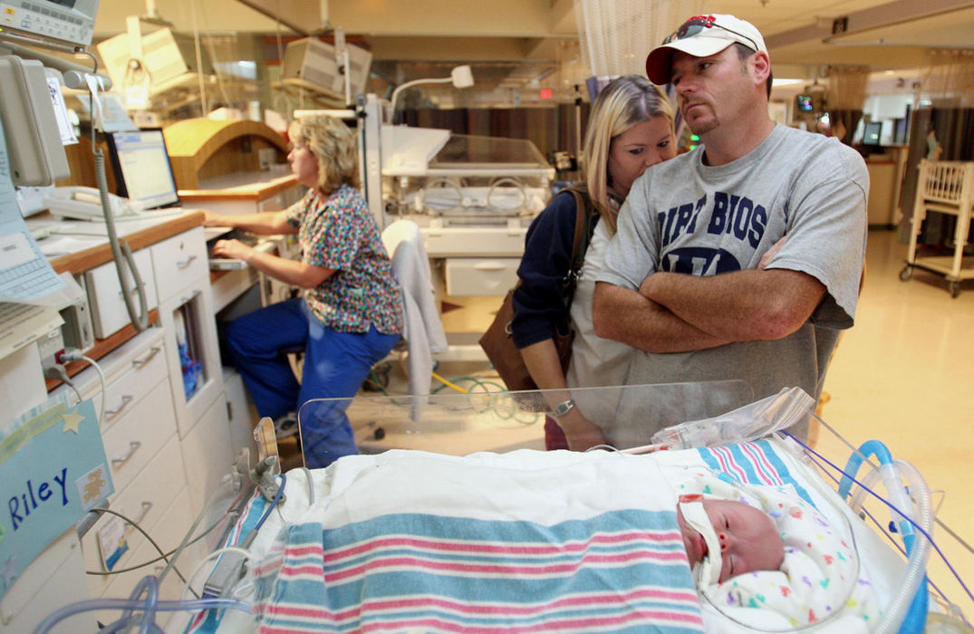 First Place, Feature Picture Story - Chris Russell / The Columbus DispatchRiley is out of his incubator briefly before heading to laser eye surgery that must performed now or risk blindness.   Beth and John prepare themselves for the procedure that could be dangerous.  