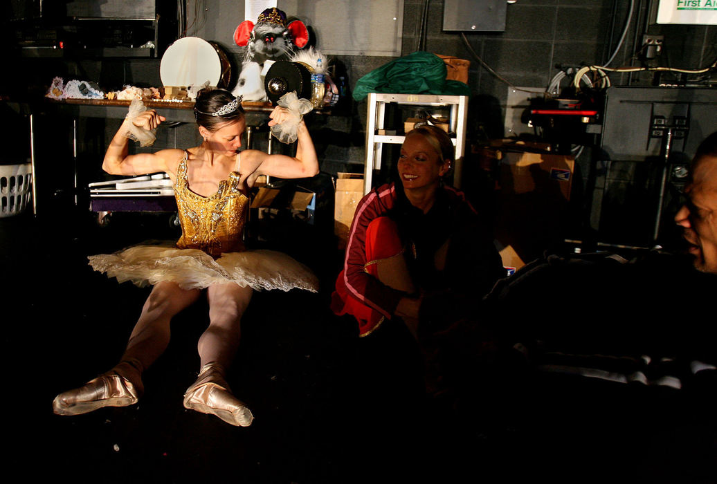 Award of Excellence, Feature Picture Story - Lisa DeJong / The Plain Dealer Ballerinas are anything but delicate as Jennifer Hogue demonstrates as she clowns around in the wings during dress rehearsal for the Nutcracker.