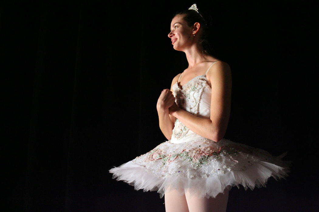 Award of Excellence, Feature Picture Story - Lisa DeJong / The Plain Dealer Janet Strukely, 24, waits for her cue to dance the part of the Sugar Plum Fairy during dress rehearsal for the Nutcracker.
