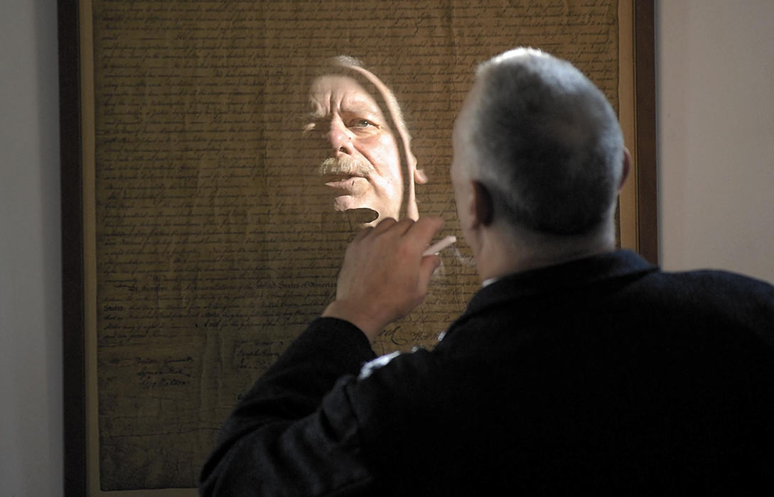 Award of Excellence, Feature Picture Story - Tim Johnson / Suburban News PublicationsVolunteer teacher Terry Siemer looks for errors in a copy of the Declaration of Independence while teaching the importance of handwriting to students.