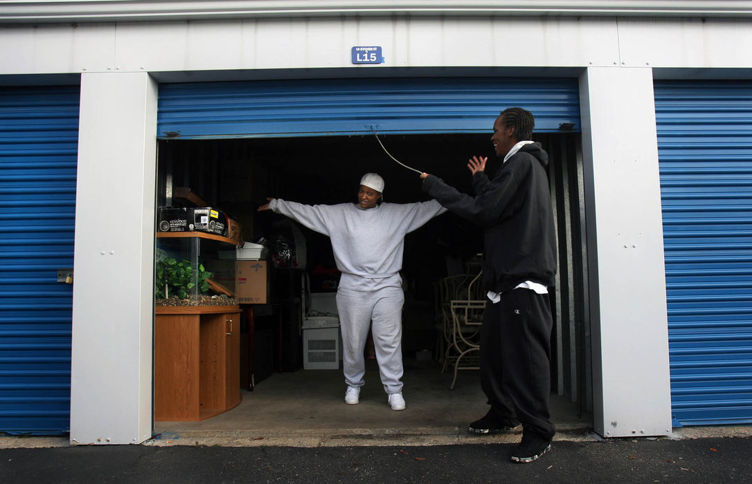 First Place, News Picture Story - Gus Chan / The Plain DealerCaldwell celebrates after getting everything into her self storage unit on moving day.