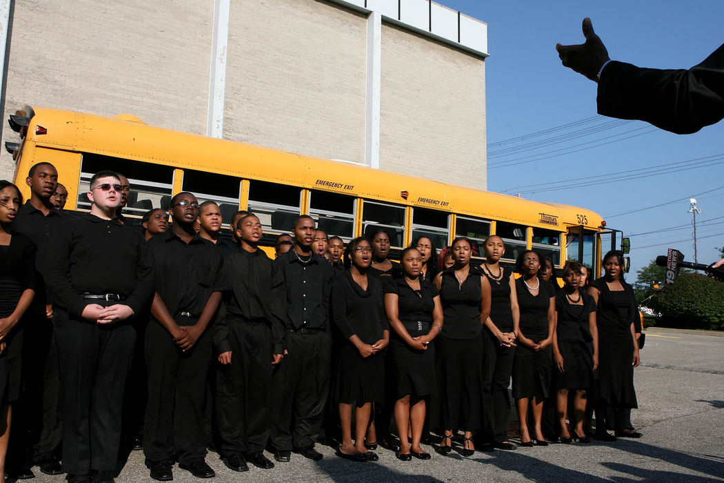 Third Place, News Picture Story - Lisa DeJong / The Plain Dealer The high school choir from Cleveland School of the Arts practices singing "Steal Away Home" for the funeral service for Asteve' Thomas, just outside of  Mount Sinai Baptist Church. Thomas was a stand-out student at the school, a poet and a member of this choir.
