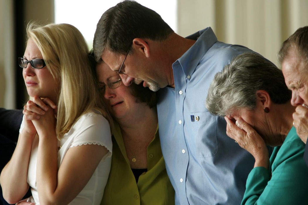 Award of Excellence, News Picture Story - Ken Love / Akron Beacon JournalEmily Kuglics, 18, (left) sobs with her parents Donna and Les Kuglics (center) and grandparents, Teresa and Lewis Kuglics as the casket of her brother, Air Force Staff Sgt. Matthew J. Kuglics is seen for the first time after arriving home from Iraq. 