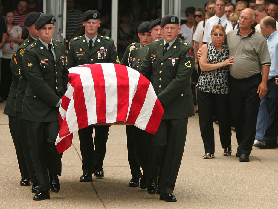 Award of Excellence, News Picture Story - Ken Love / Akron Beacon JournalU.S. Army Cpl. Zachary A. Grass, 22, is carried by a Army Honor Guard from Fairless High School. 