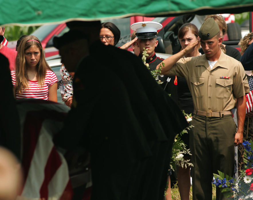 Award of Excellence, News Picture Story - Ken Love / Akron Beacon JournalA U.S. Army Honor Guard places the casket of U.S. Army Cpl. Zachary A. Grass, 22, at his gravesite at Welty Cemetery on June 25, 2007 in Sugarcreek. 