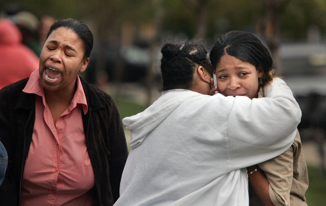 Award of Excellence, News Picture Story - Gus Chan / The Plain DealerA distraught mother, left, cries after bringing her daughter, right, out of SuccessTech School after a student opened fire shooting a teacher and students before turning the gun on himself.