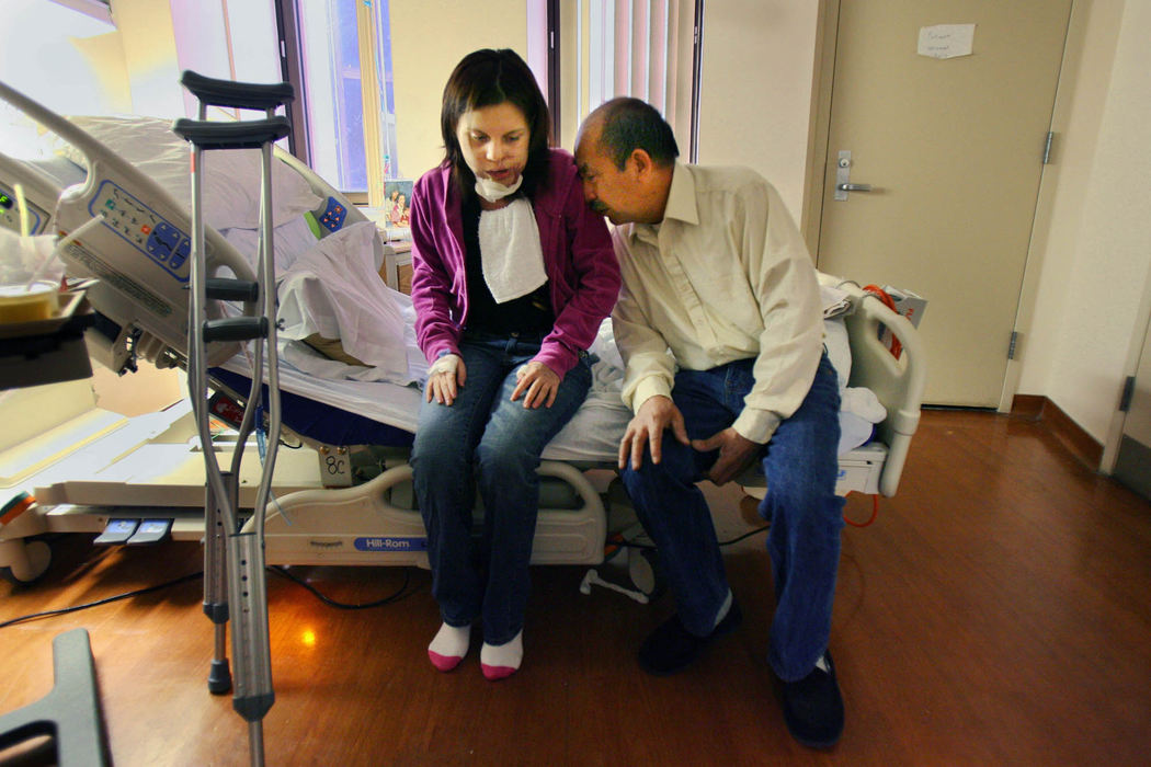 First Place, James R. Gordon Ohio Understanding Award - Gus Chan / The Plain DealerJohanna Orozco gets a kiss from her grandfather while waiting for Dr. Michael Fritz to come by to discharge them.  