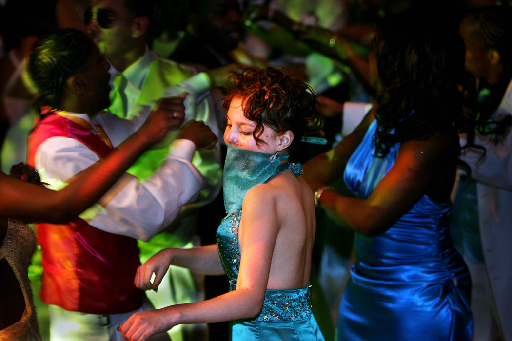 First Place, James R. Gordon Ohio Understanding Award - Gus Chan / The Plain DealerJohanna Orozco dances with a group of friends at the Lincoln West prom.