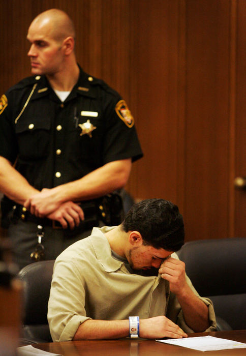 First Place, James R. Gordon Ohio Understanding Award - Gus Chan / The Plain DealerJuan Ruiz wipes away tears before pleading guilty to all charges of rape and attempted aggravated murder in the shooting of his former girlfriend, Johanna Orozco.  