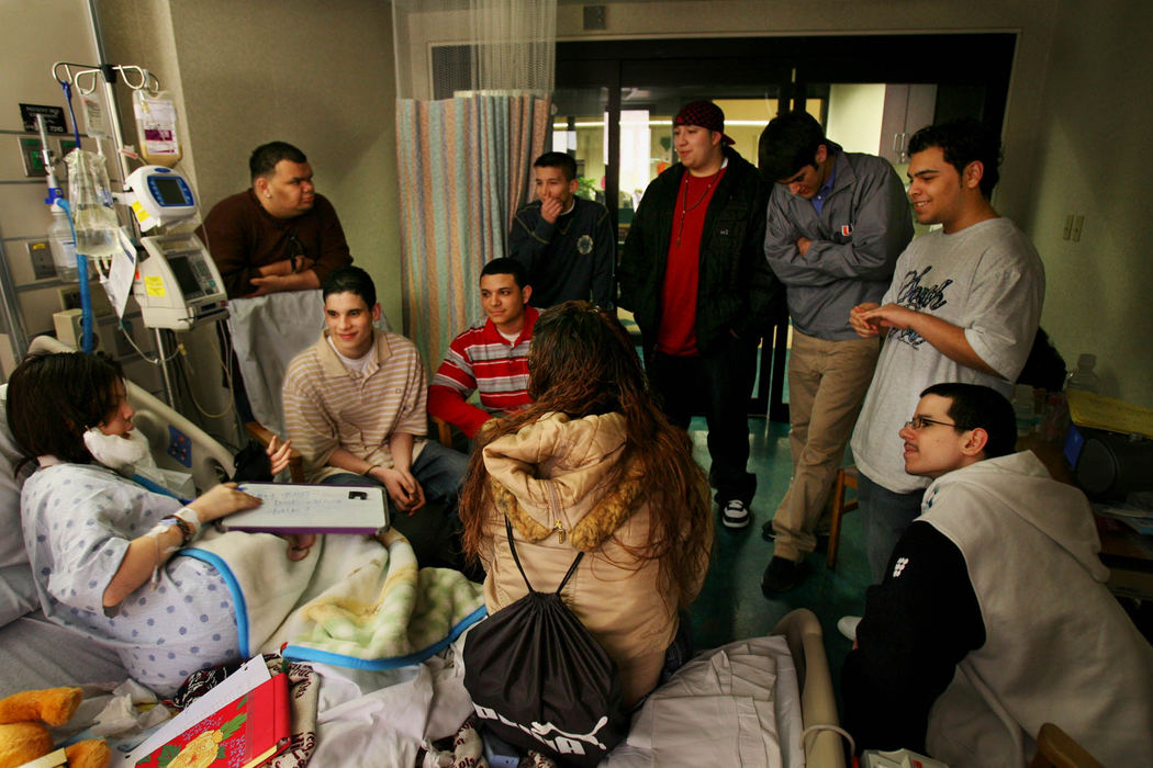 First Place, James R. Gordon Ohio Understanding Award - Gus Chan / The Plain DealerA constant stream of visitors in the hospital room at MetroHealth.