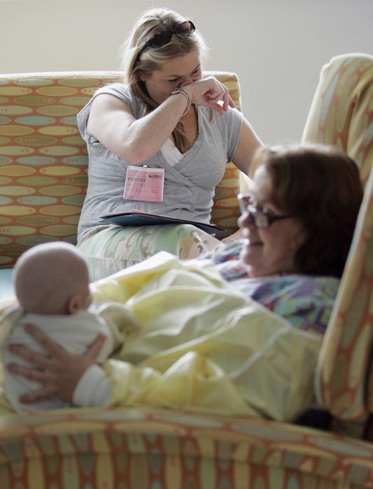 Second Place, James R. Gordon Ohio Understanding Award - Chris Russell / The Columbus DispatchFor months Beth has relied on the Children's Hospital staff to care for Riley, but during a day full of lessons concerning the care she will have to give all by herself she begins to become overwhelmed and wipes away tears. 