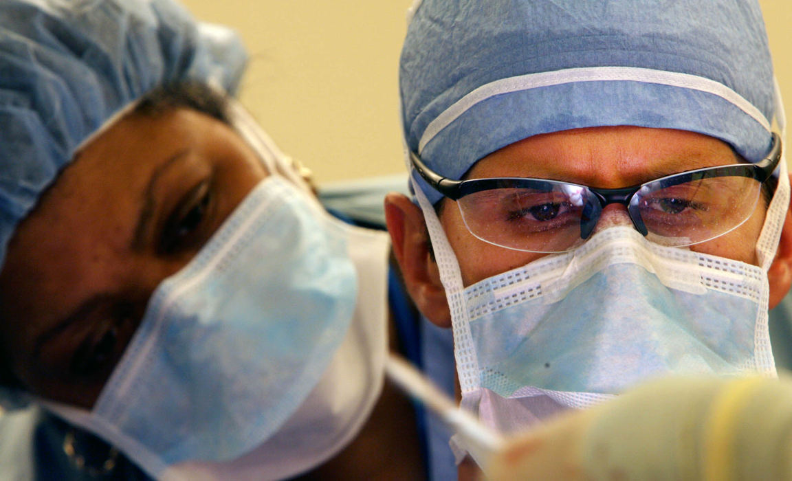 First Place, James R. Gordon Ohio Understanding Award - Gus Chan / The Plain DealerDr. Michael Fritz during a thirteen hour surgery to make Johanna's new jaw at MetroHealth.