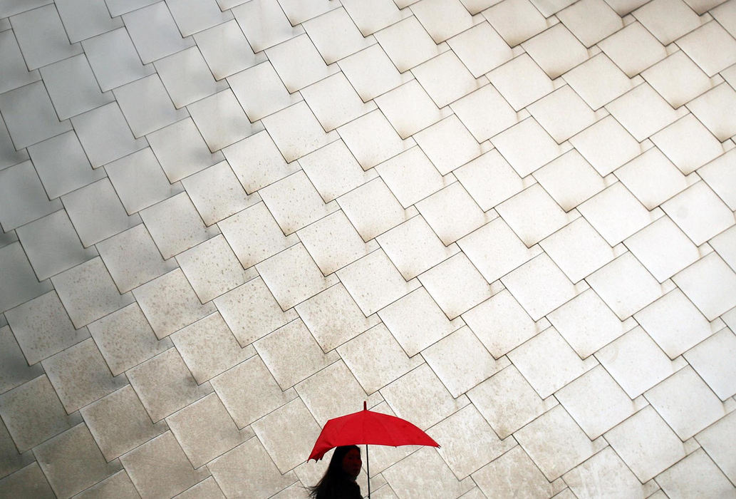 Award of Excellence, Pictorial - Chris Stephens / The Plain DealerA red umbrella breaks the pattern of stainless-steel shingles resembling fish scales on the roof of the Frank Gehry-designed Peter B. Lewis building at Case Western Reserve University in Cleveland.