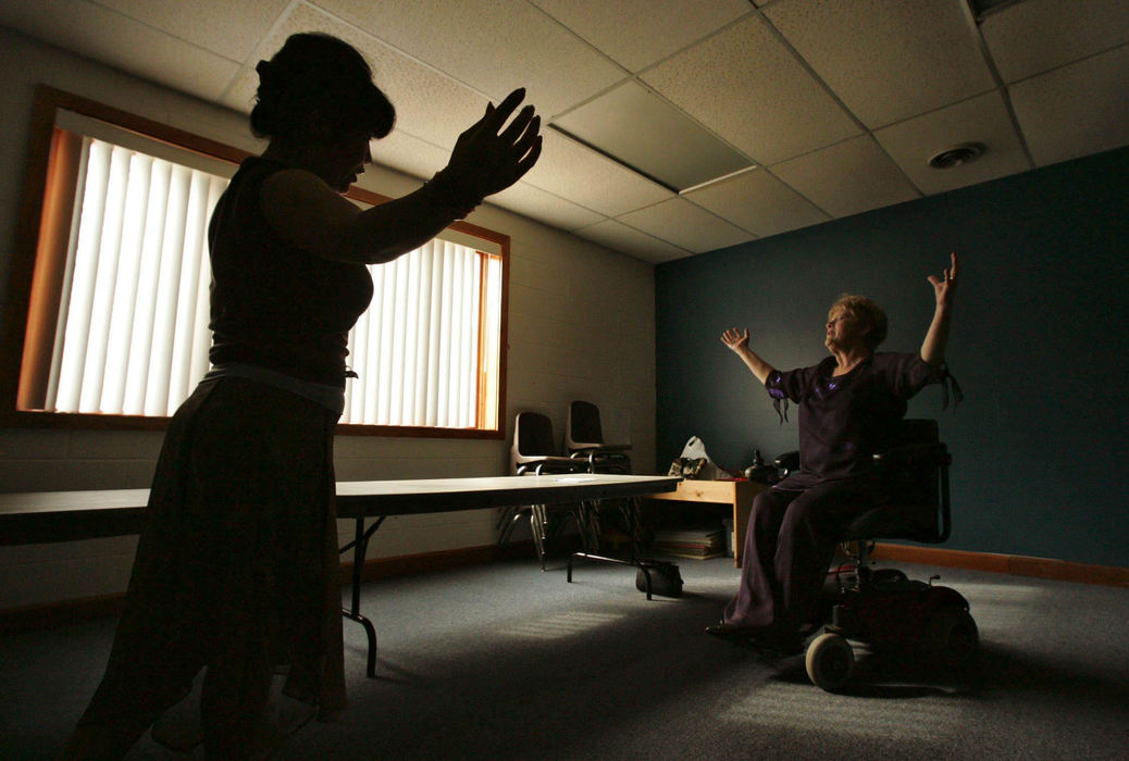 Award of Excellence, Photographer of the Year - Ken Love / Akron Beacon JournalMs. Wheelchair Ohio 2006, Carol Tolson, (right), from Akron works on a dance routine with instructor Sunhee Starkey in preparation  for the 2007 pageant.