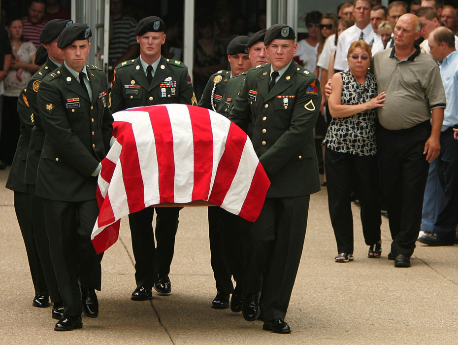 Award of Excellence, Photographer of the Year - Ken Love / Akron Beacon JournalU.S. Army Cpl. Zachary A. Grass, 22, is carried by a Army Honor Guard from Fairless High School.