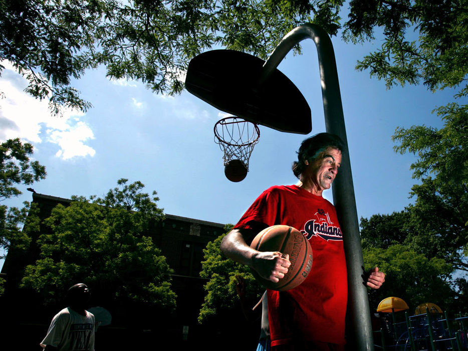 Award of Excellence, Photographer of the Year - Phil Masturzo / Akron Beacon JournalAlthough he is legally blind, Alan "Al" Denny, 63, walks 2.5 miles, five days a week, to play basketball at the King School playground. Denny shoots baskets for a few hours and often joins in some pickup games with players 40-50 years younger. 