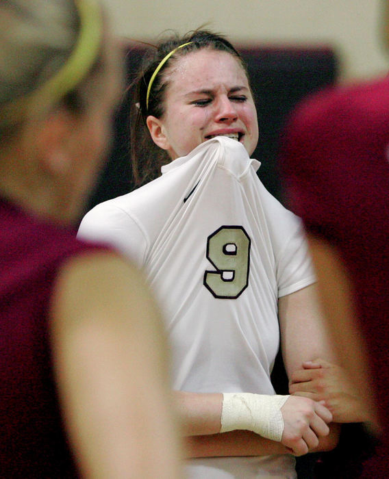 Award of Excellence, Photographer of the Year - Phil Masturzo / Akron Beacon JournalWalsh's Leanne Butkovic feels the pain of the Warriors 3-2 loss to Salem during the Div. II Regional Volleyball tournament. 