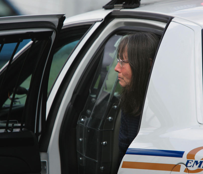 Award of Excellence, Photographer of the Year - Phil Masturzo / Akron Beacon JournalCandy Campbell, 54, sits in the back of a police cruiser after a standoff situation between Akron police and her husband, Alexander Campbell, in the Kenmore area, Thursday, April 19, 2007 in Akron, OH. 