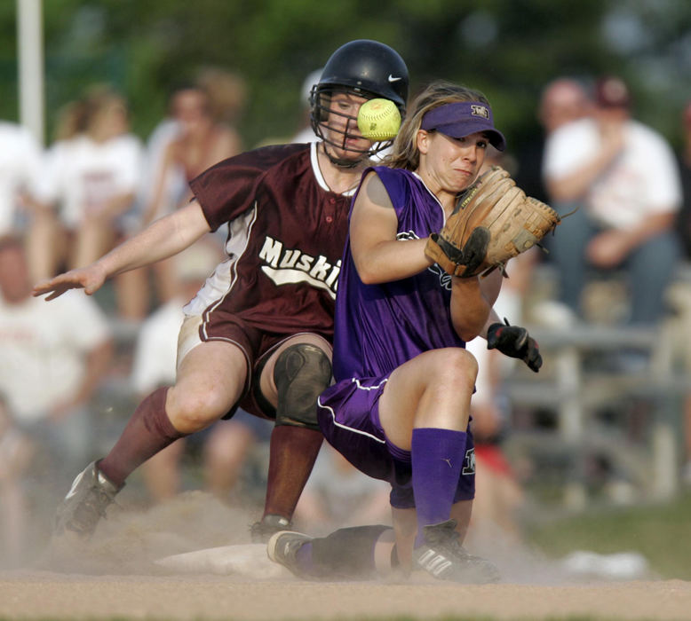 First Place, Photographer of the Year - Chris Russell / The Columbus DispatchSt Francis DeSales'  Lauren Miller loses the handle on this throw to second and John Glenn's  Jenna Shingary is safe at second.  She moved on to score the winning run and defeat DeSales in extra innings.  