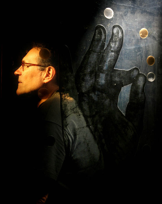 Second Place, Photographer of the Year - Lisa DeJong / The Plain DealerChristopher Pekoc, 65,  photographed through one of his polyester film art pieces, has won a Cleveland Arts Prize award for his work in the visual arts. Hands have been an ongoing theme with him for years. Pekoc is also Lecturer in Drawing in the Art Studio of Case Western Reserve University. 