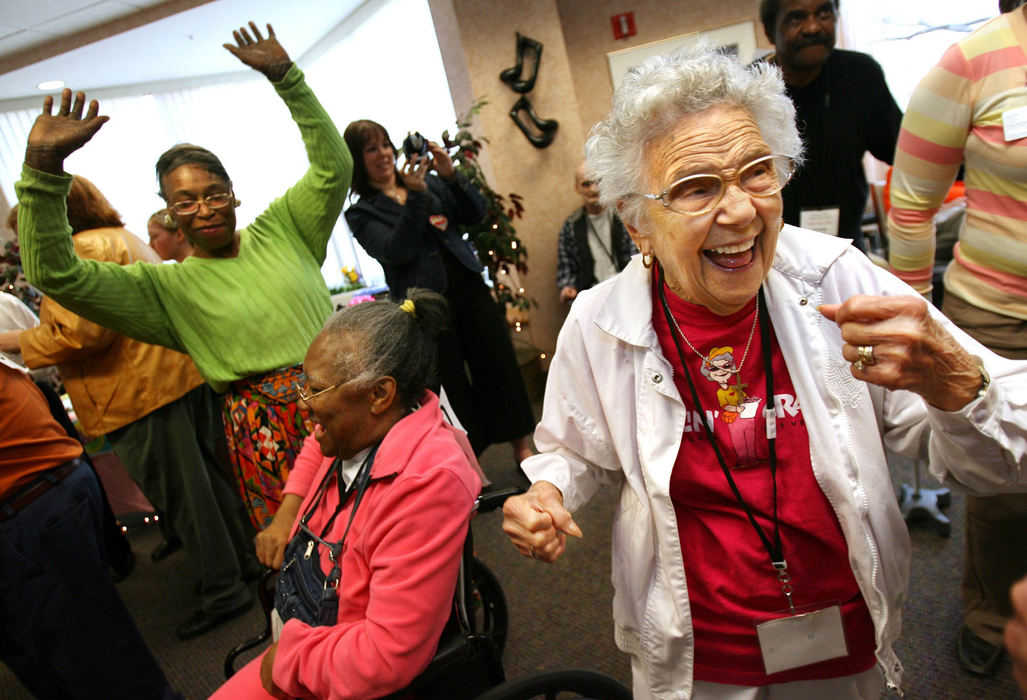 Second Place, Photographer of the Year - Lisa DeJong / The Plain DealerGwendolyn Connally, 93, right, dances to the disco song "Freak Out," during a dance competition at the Menorah Park Adult Day Center in Beachwood. The senior citizens competed in various dance categories such as the "Chicken Dance", the "Best High Stepper" and "Dancing Wheels". 