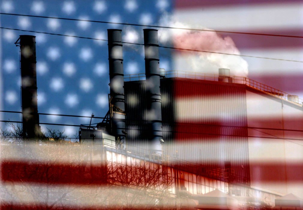 Second Place, Photographer of the Year - Lisa DeJong / The Plain DealerThe Ford Cleveland Casting Plant is seen in a reflection from across the street in a storefront window where an American Flag is displayed. Ford Motor Co., who has continuously boasted about its All-American trucks, announced during a press conference  at their union hall next door that it will close the largest of its three plants in Brook Park. Cleveland Casting, a 1,200-job plant that forges engine blocks and other parts, will close in 2009. At that point, Ford will outsource all of its North American engine casting business.  