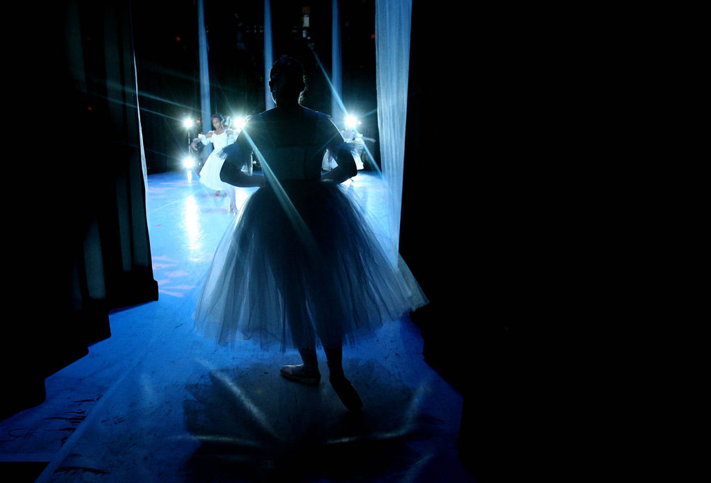 Second Place, Photographer of the Year - Lisa DeJong / The Plain DealerA ballerina waits in the wings for her cue for the snow scene during dress rehearsal for the Nutcracker.