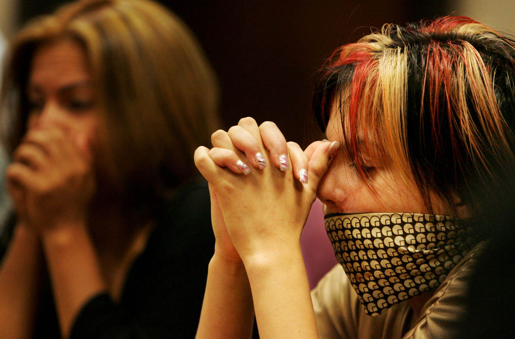 Third Place, Photographer of the Year - Gus Chan / The Plain DealerJohanna Orozco waits to hear from the defense attorney whether they will plead out in Juan Ruiz's trial.  