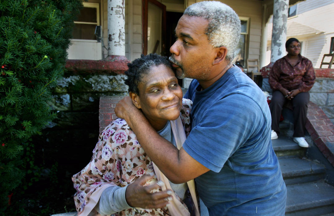Third Place, Photographer of the Year - Gus Chan / The Plain DealerRodney Johnson (right) gives a kiss to Helen Haynes, a 74-year-old woman he pulled out of an apartment fire.  Six adults and twelve children were left homeless in the four unit blaze on E. 102nd St.