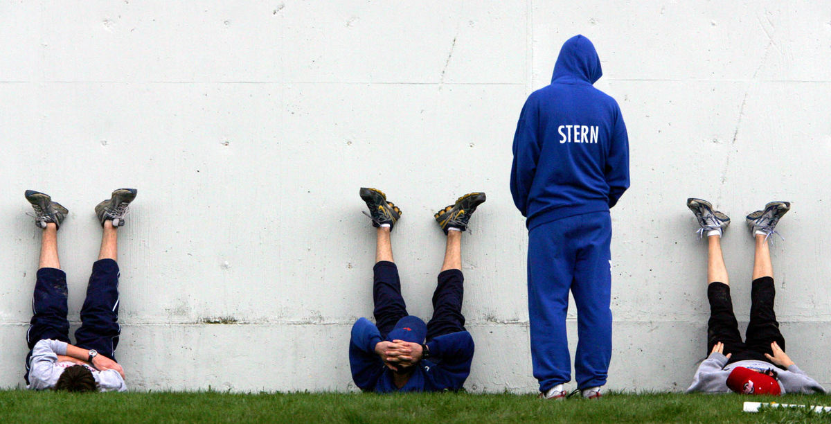 Third Place, Photographer of the Year - Gus Chan / The Plain DealerTyler Stern, of Brunswick (second from right) watches teammates (from left) Corey Guastini, Brad Neumann and Devon Snack stretch during warmups at the Berea Kiwanis Relays.