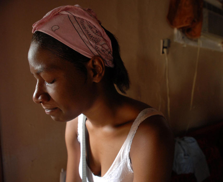 First Place, Portrait/Personality - Abigail Bobrow / Sandusky RegisterMaleka Bassir, 27, is overcome with emotion as she recalls the events surrounding the death of her brother, 17-year-old Mufaro "Teddy" Young, who recently died from an asthma attack May 9, 2007 in his Sandusky home. Bassir also suffers from the condition.