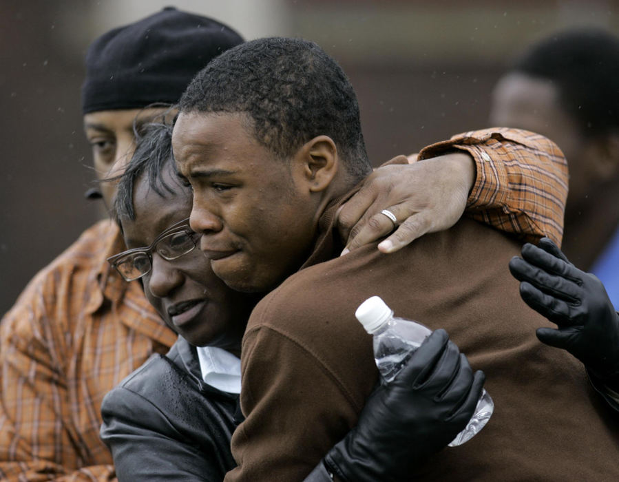 Award of Excellence, Spot News over 100,000 - Tony Dejak / Associated PressFamily are reunited outside the SuccessTech Academy, Oct. 10, 2007, in Cleveland. A gunman opened fire at the alternative school and three children were taken to a hospital, the mayor said. 