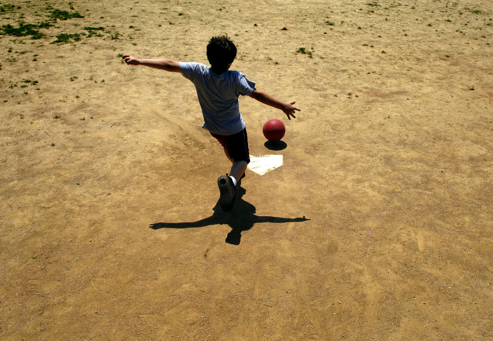 First Place, Student Photographer of the Year - David Foster / Kent State UniversityKeith Lowe gets set to kick during a kickball game between Westerville's Whittier Elementary fourth graders and the James Cancer Hospital, May 19, 2007.