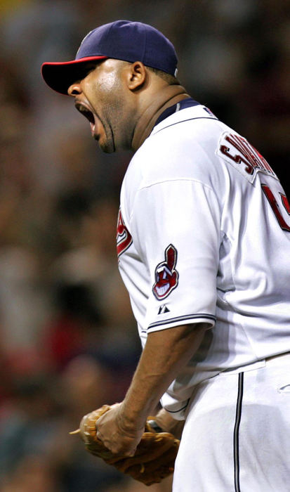 Second Place, Sports Picture Story - Chuck Crow / The Plain DealerThe 2007 baseball season for the Cleveland Indians put the baseball players through an emotional ride, from several late inning victories to the season ending dejection. Lead by pitching ace C.C. Sabathia, the  Indians won the AL Central Division title to advance to the playoffs for the first time since 2001, the first time for most of these young ball players. After defeating the New York Yankees in the divisional series, the Tribe lost in 7 games to the Boston Red Sox. Here is their Emotional Ride. Cleveland Indians pitcher C.C. Sabathia, their ace pitcher who would the team all season, is fired up, growling after pitching a complete game to beat the Oakland A's 5-2 and tying Boston's Josh Beckett for the most wins in the American League with 11.