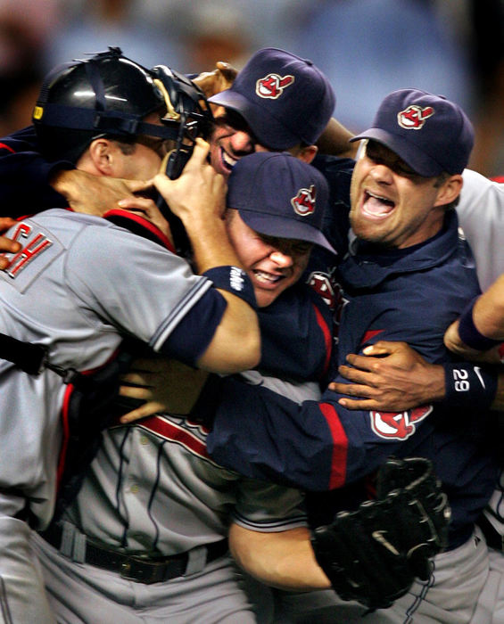 Second Place, Sports Picture Story - Chuck Crow / The Plain DealerCleveland Indians players, including closer Joe Borowski (center) and winning pitcher Paul Byrd (right) erupt in joy after getting the final out of the American League Division Series, beating the New York Yankees 6-4, and advancing to the ALCS against the Boston Red Sox.