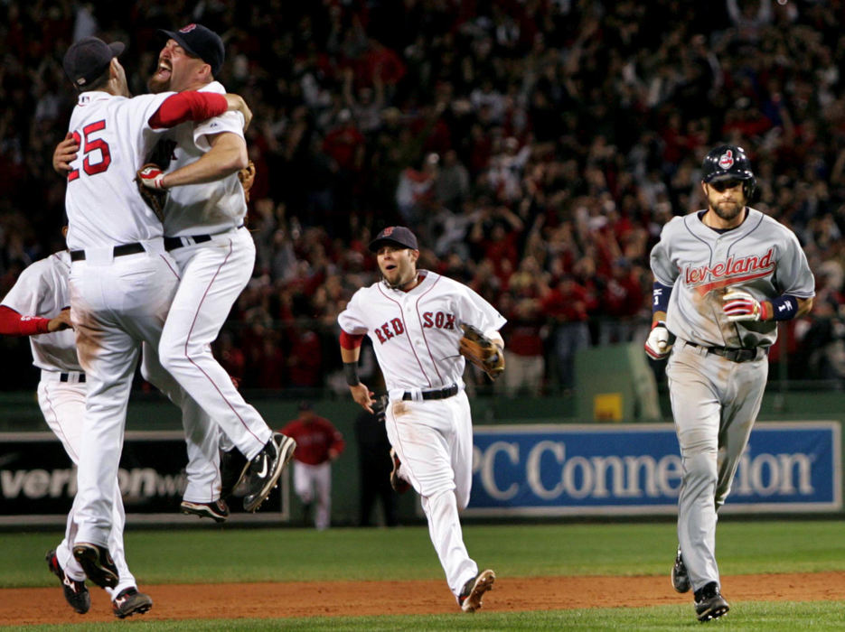 Second Place, Sports Picture Story - Chuck Crow / The Plain DealerCleveland Indians' Casey Blake runs off the field after making the final out of game 7 of the ALCS as the Boston Red Sox players jump for joy winning the AL pennant at Fenway Park. The Red Sox won 4 games to 3 and advance to the World Series.