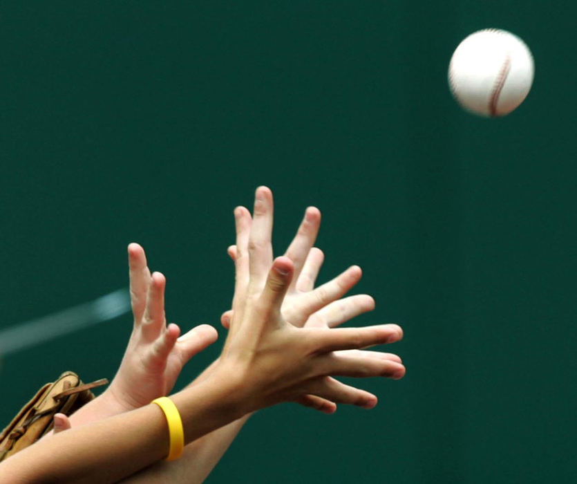 Third Place, Sports Picture Story - Chuck Crow / The Plain DealerOn a hot summer day, fans reach for a baseball souvenir thrown by one of the Cleveland Indians before the sold-out game between the Indians and the New York Yankees.