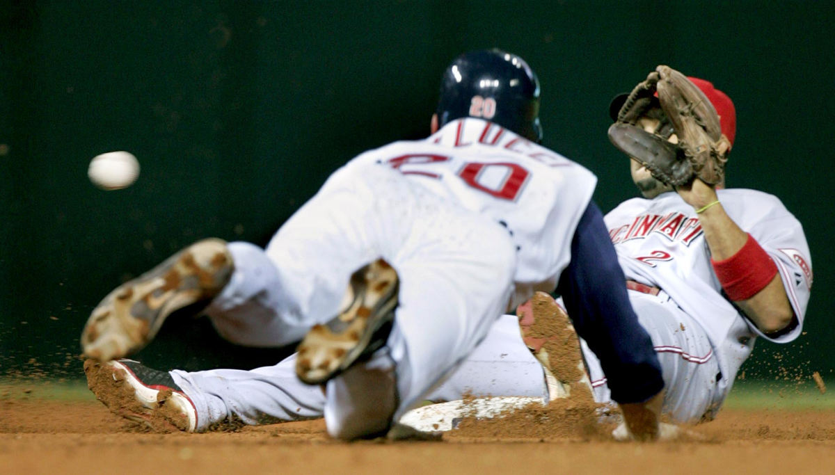 Third Place, Sports Picture Story - Chuck Crow / The Plain DealerA wacky play at second base as the Cincinnati Reds' shortstop Alex Gonzalez slipped covering second base and fell right on top of the base on a steal attempt by the Indians Dave Dellucci. Gonzalez amazingly caught the ball but Dellucci was safe on the play.