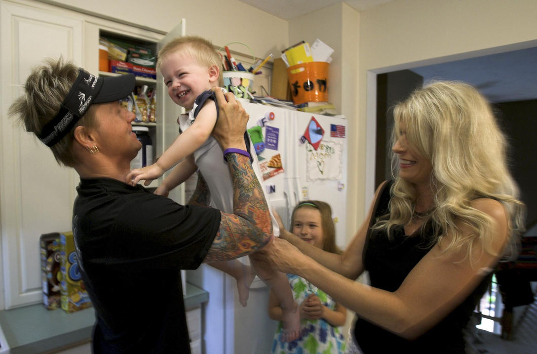 First Place, Sports Picture Story - Andy Morrison / The BladeTodd Crandall and wife Melissa play with son Mason, and daughter Skylar, 9, while making breakfast.