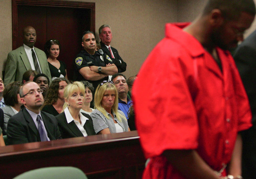 First Place, Team Picture Story - Karen Schiely / Akron Beacon JournalJessie Davis' mother, Patty Porter (seated center), watches with lawyer Rick Pitinii as Bobby Cutts Jr. (right) appears in court.  Cutts waived his right to a preliminary hearing in Jessie Davis' murder. Cutts was later charged with aggravated murder and other charges and is awaiting trial on those charges.