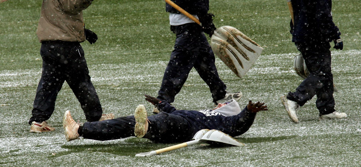 Second Place, Team Picture Story - CHUCK CROW / The Plain DealerA member of the grounds crew makes a snow angel in the outfield grass.