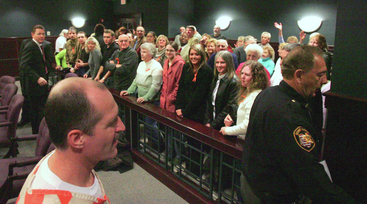 Third Place, Team Picture Story - Ken Love / Akron Beacon JournalRandy Resh leaves the courtroom of Judge Laurie J. Pittman after the judge granted him a release bond, Jan. 19, 2007, in Ravenna. Resh is free on bond as he awaits a new trial in a 1988 murder case. In a unanimous decision Dec. 26, the Ohio Supreme Court ordered new trials for Resh and Bob Gondor and vacated their convictions in the 1988 kidnapping, attempted rape and murder of Connie Nardi, 31, of Randolph Township. Resh and Gondor, now 43 and 42, respectively, were tried separately and convicted of Nardi's slaying in 1990.