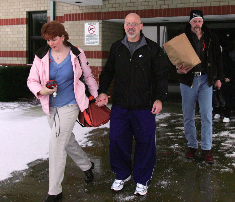 Third Place, Team Picture Story - Ken Love / Akron Beacon JournalBob Gondor (center) leaves the Portage County Jail with family friend Patty Vechery of Chardon. Gondor is free on bond as he awaits a new trial in a 1988 murder case. Earlier in the day Randy Resh who was tried separately in the 1988 kidnapping, attempted rape and murder of Connie Nardi was also granted release on bond after the Ohio Supreme Court ordered new trials for the two men.